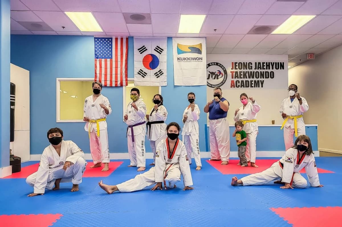 JTA students training under the US, Korean, and Kukkiwon flags